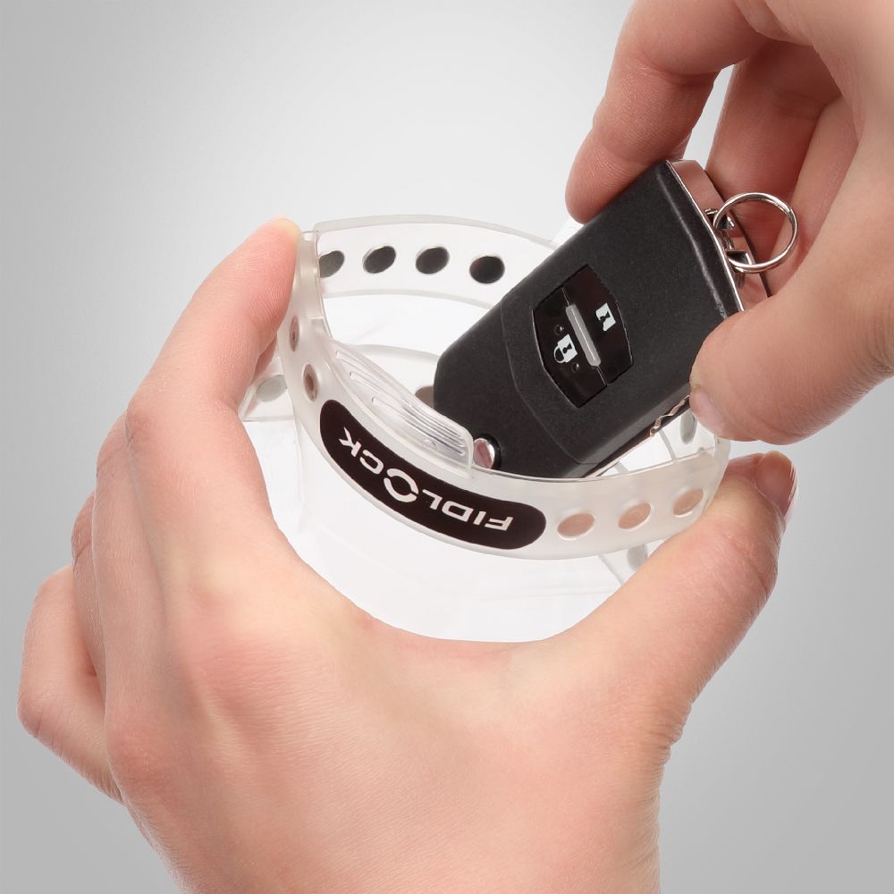 Fidlock Waterproof Car Key Dry Case Mini placing objects inside through opening