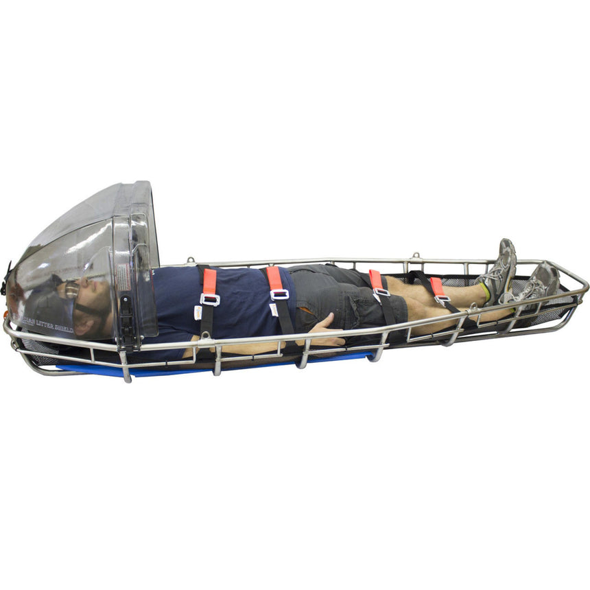 Cascade Rescue Guardian Litter Shield full view attached to a rescue litter with a patient strapped inside a litter