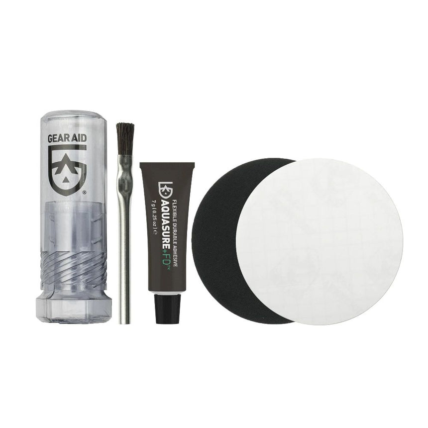 Gear Aid Aquasure +FD Repair Kit showing Kit contents which are: a kit storage container, an adhesive application brush, Aquasure +FD Adhesive, a clear and a black tenacious tape patch