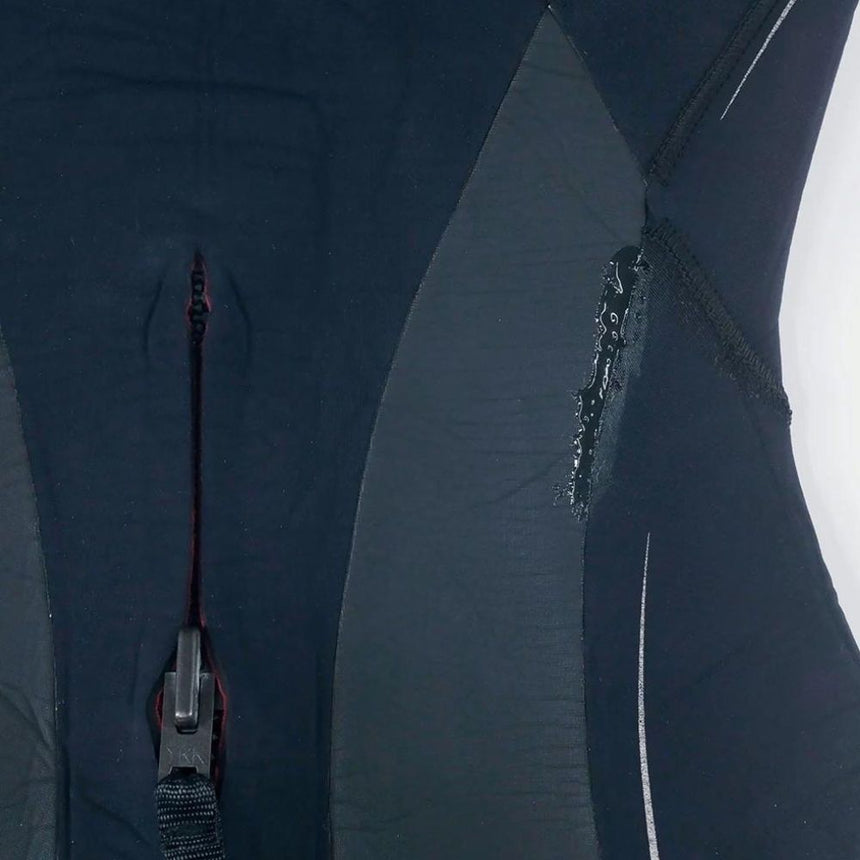 Wetsuit close up of repair made with Gearaid Aquasure FD Repair Adhesive. Illustrating it dries clear.