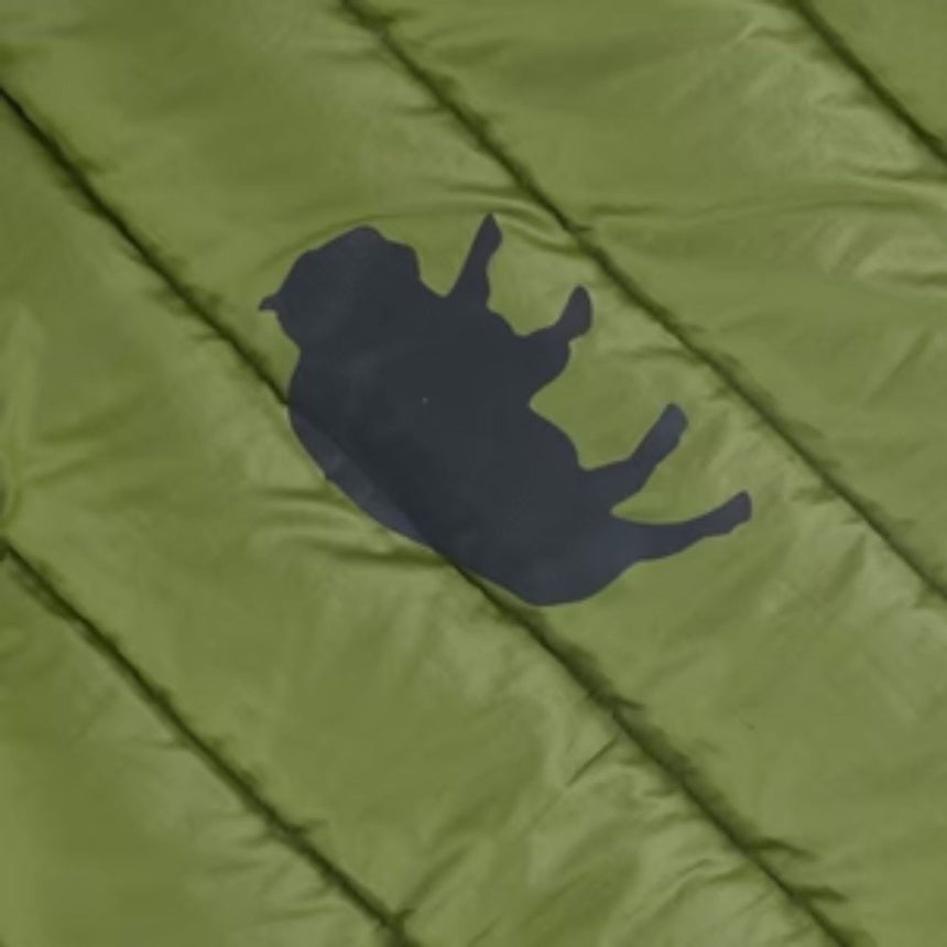 Gear Aid Tenacious Tape Nylon Gear Patch in the shape of a bull on a green puff jacket to repair a hole