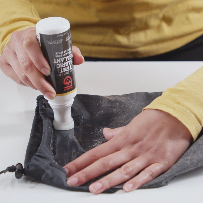 Hand model using Gear Aid Seam Grip Tent Fabric Sealant to Waterproof