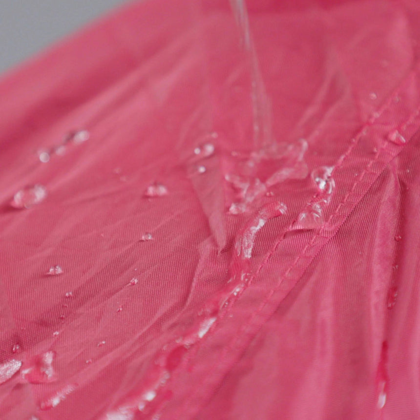 Demonstration of Waterproofing on a Red Tent after using Gear Aid Tent Water Rellent