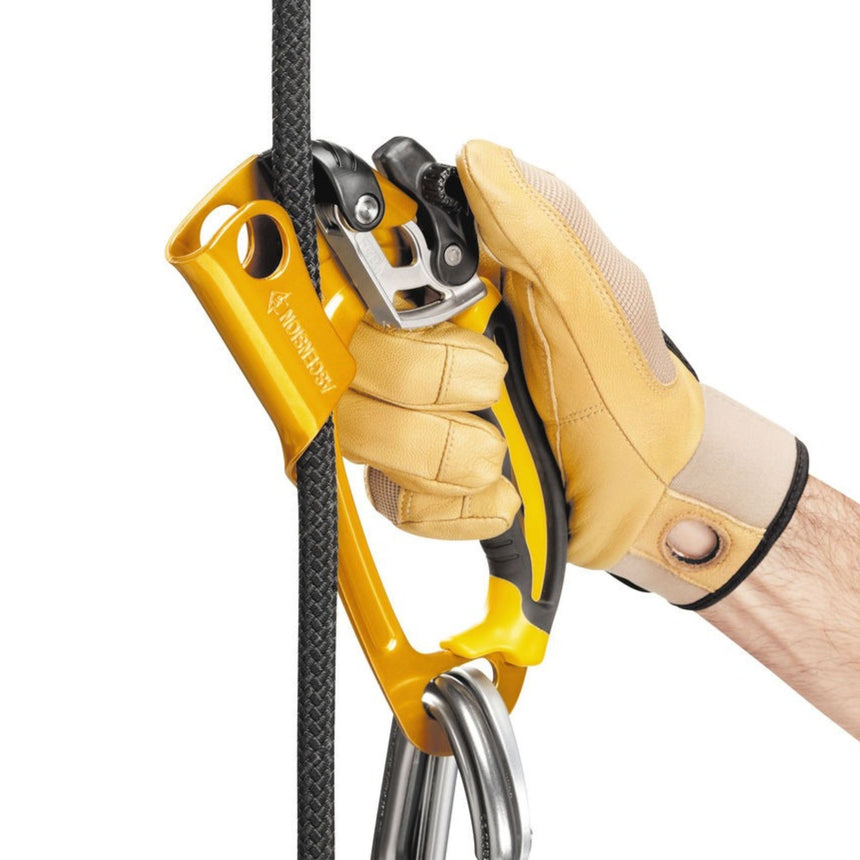 Professional showing the safety catch on the Petzl Ascension which allows the handled rope clamp to be installed or removed anywhere on the rope with one hand. It is easily manipulated, even with gloves.
