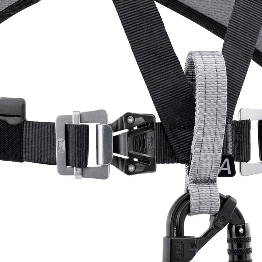 Petzl Chest Air Rescue Harness Close up to highlight product feature donning and removing the harness is quick and easy, even with thick clothing. with the Fast LT buckles at the chest.