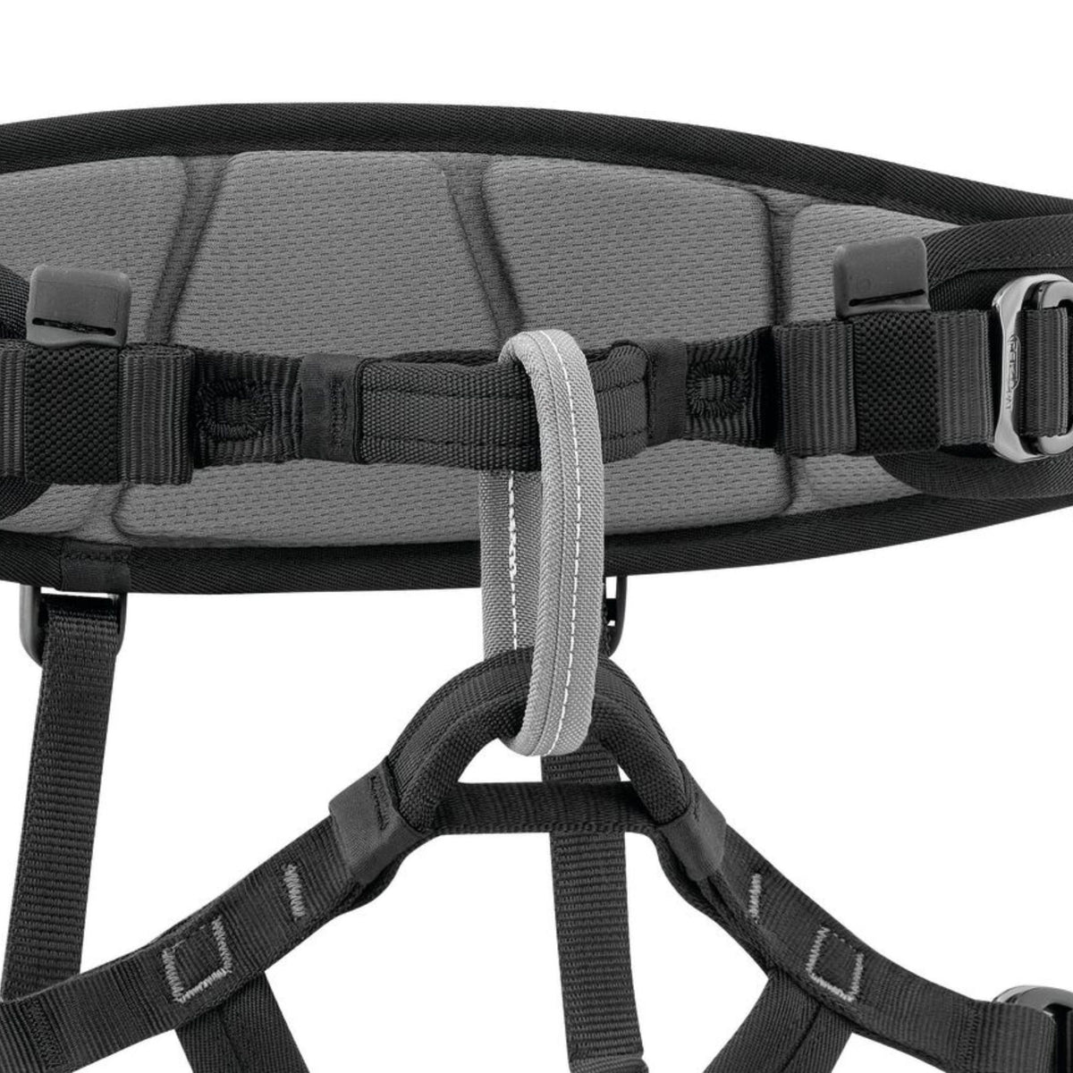 Petzl Falcon Mountain Rescue Harness close up showing Ventral attachment point with textile bridge favours progression with climbing techniques and makes for comfortable walking.