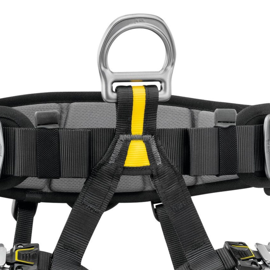 Petzl Falcon Seat Harness featuring a close up of the metal ventral attachment point which distributes the load between the waistbelt and leg loops during suspension.