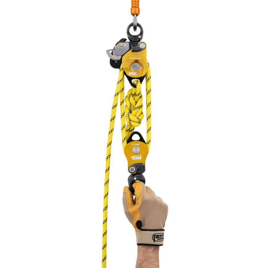 Petzl Twin Release Pulley cam can be locked in the open position to make it easier to feed slack.