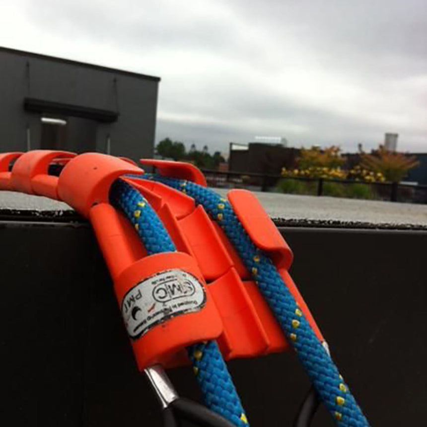 Close-up of the SMC Rope Tracker articulating around an edge, managing 2 ropes securely during a rigging scenario