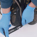 Gear Aid Aquasure SR Shoe Repair Adhesive being applied to boot sole