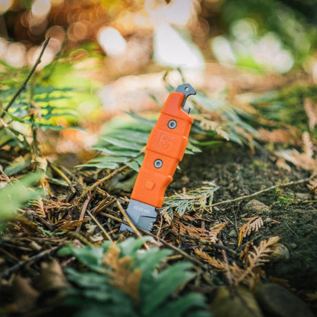 Gear Aid Buri Knife with Orange Handle  Outside in the woods 