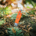 Gear Aid Buri Knife with Orange Handle  Outside in the woods 