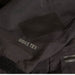 Black Rectangle Gear Aid Tenacious Tape GORE-TEX Fabric Patches used to repair a Tear in a Black GoreTex Jacket 
