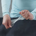 Hand Model demonstrating flexibility of Gear Aid Tenacious Tape Clear Flex Patch over air bed 