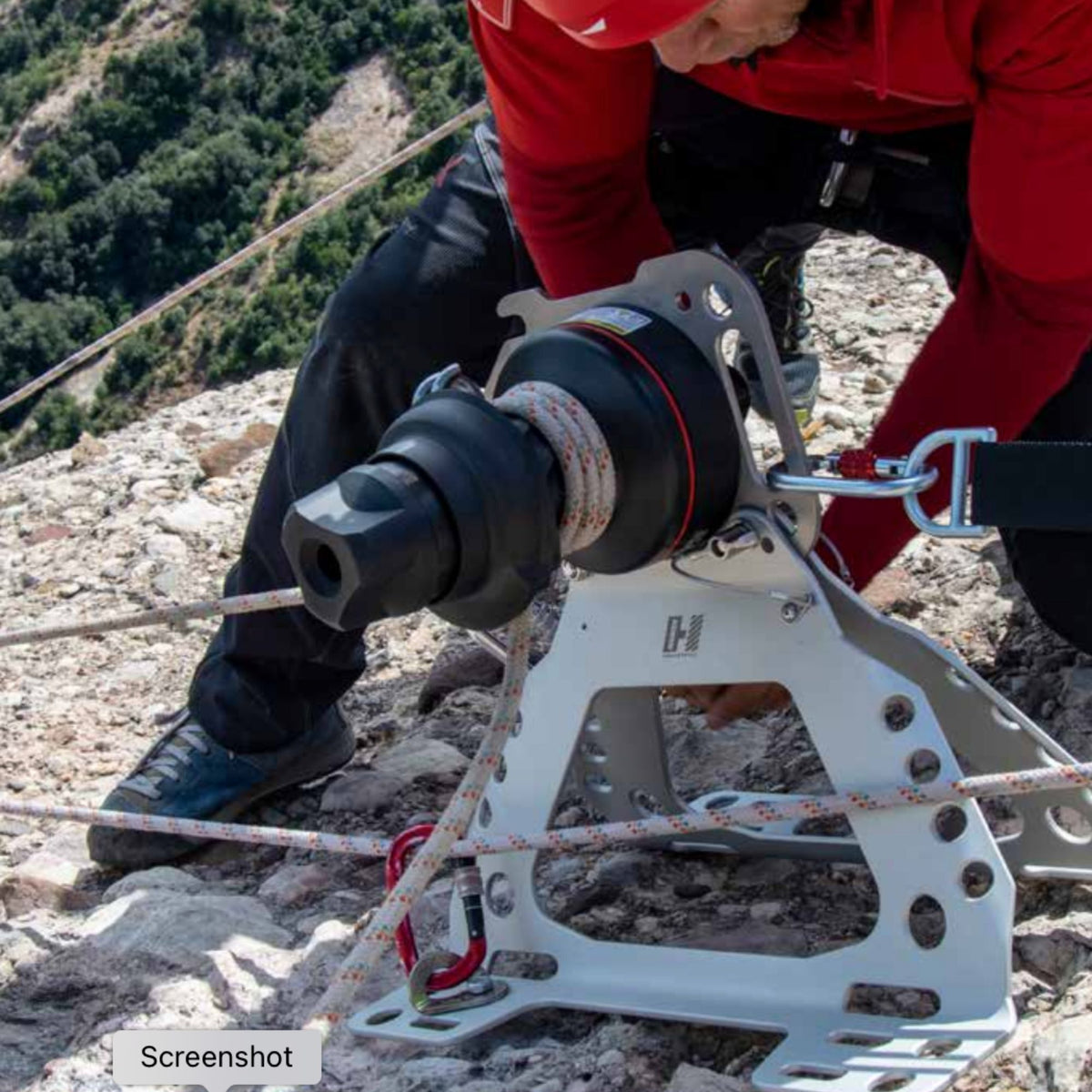Professional installing Harken LokHead Winch onto Harken Tellumount winch on rocky mountain uneven ground 