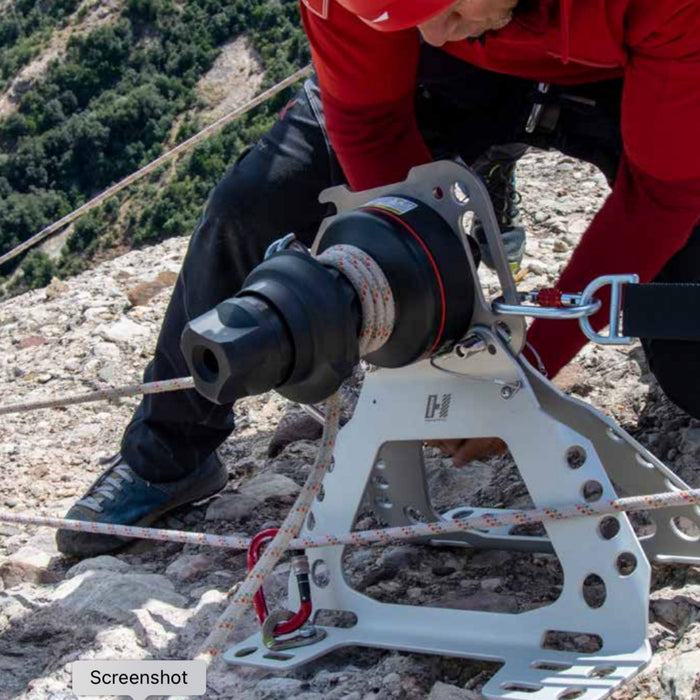 Professional installing Harken LokHead Winch onto Harken Tellumount winch on rocky mountain uneven ground 