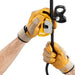 Professional wearing gloves installing a rope on the Petzl rescucender. The  openable guided cam allows easy installation or removal of the rope clamp at any point on the rope.