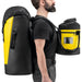 Professional wearing Petzl Transport 60 and Bucket Rope bags.  Loops on the shoulder straps of the Petzl Transport 60 can be used to attach a BUCKET rope bag to carry in front.
